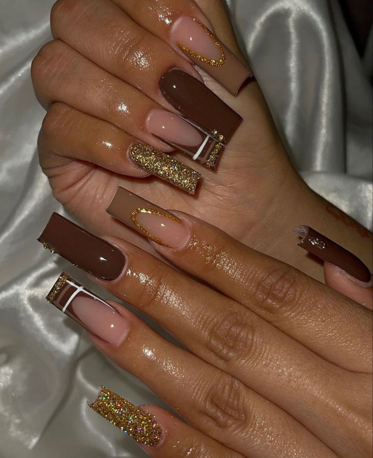 Chic Nail Design: Deep Brown and Nude with Glitter Accents and Geometric Elegance