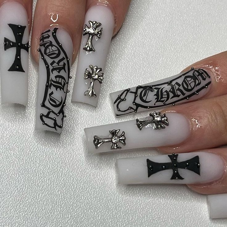 Edgy Bold Nail Design with Matte White and Glossy Black Finishes and Intricate Cross Motifs.