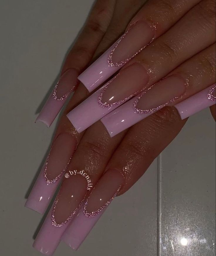 Chic Soft Pink Long Nails with Glittery Crescent Accents.