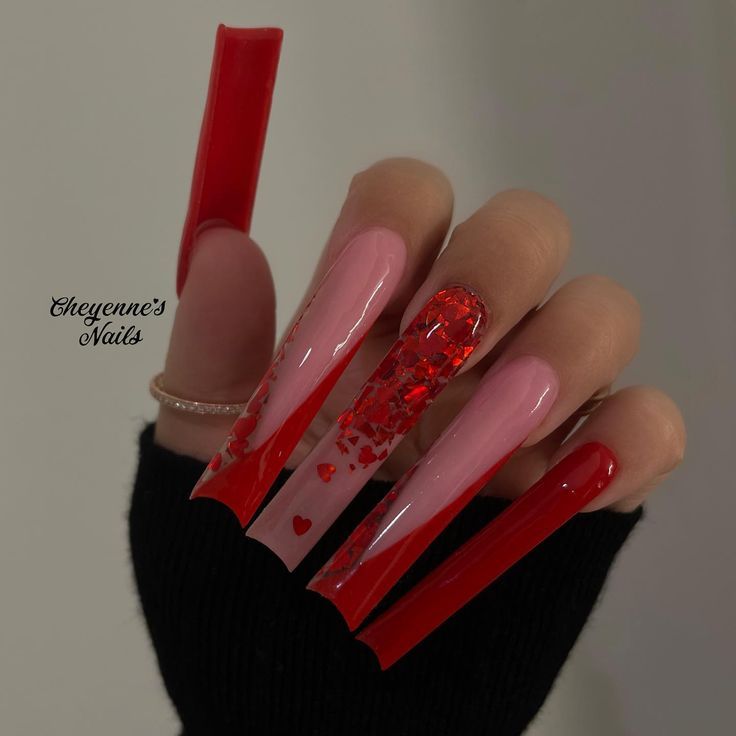 Bold and Elegant Red and Pink Glittery Nail Design with Heart Accents.