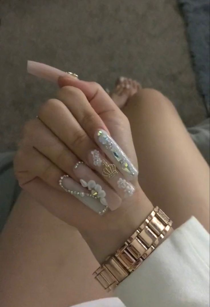 Chic Floral and Gem-Embellished Pale Pink Nail Design for Elegant Occasions.