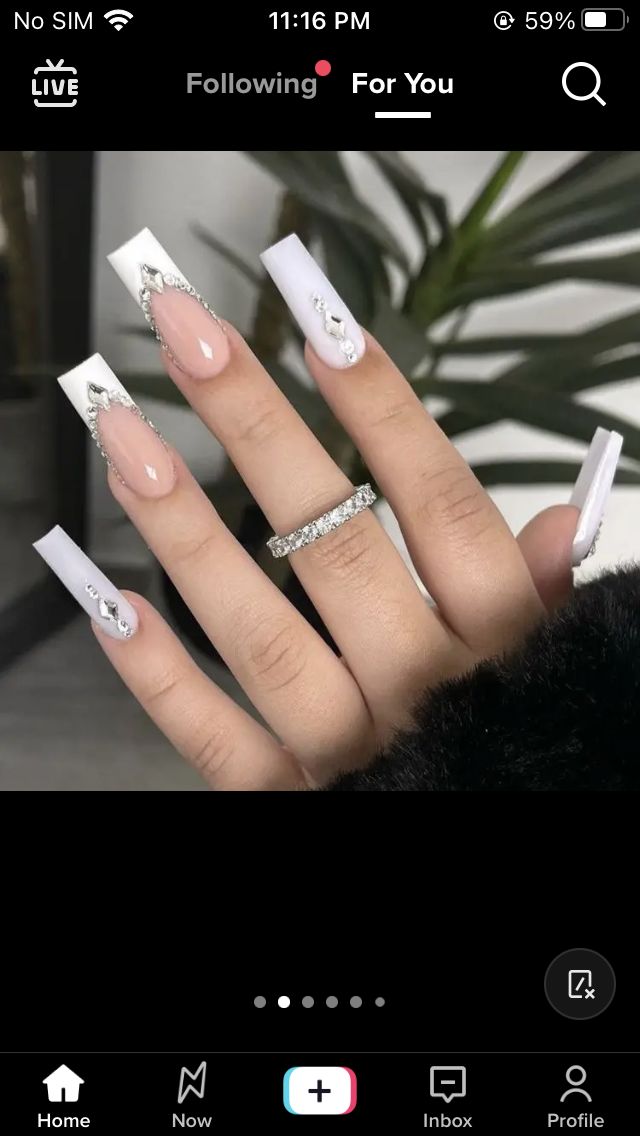 Glamorous Glossy White Acrylic Nail Design with Elegant Embellishments