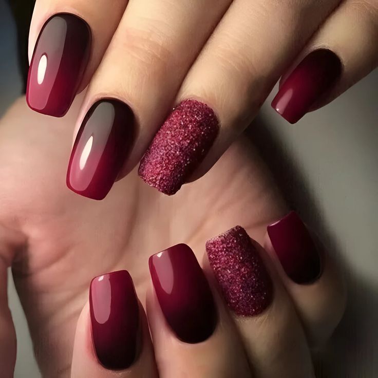 Striking Burgundy Gradient Nails with Glamorous Glitter Accent.