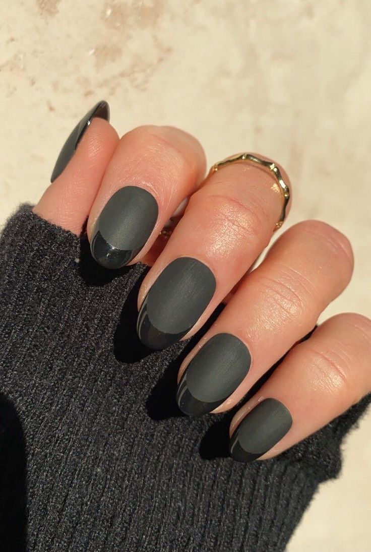 Chic Matte Black Nail Design with Glossy Tips and Elegant Accents.