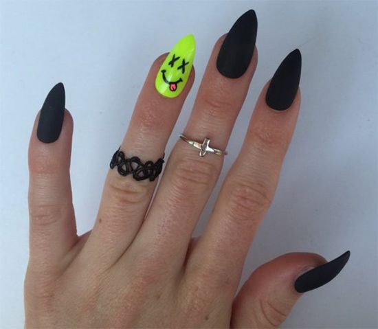 Striking bold nail design blends edgy matte black with playful neon yellow accents.