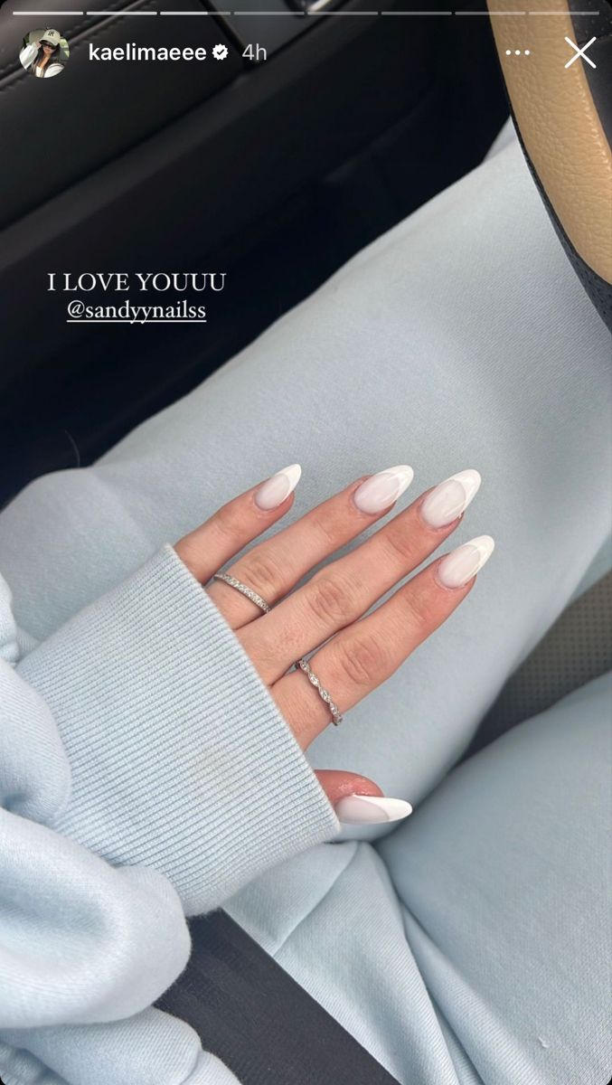 Chic Almond-Shaped Nails with White Tips: A Sophisticated and Casual Look.