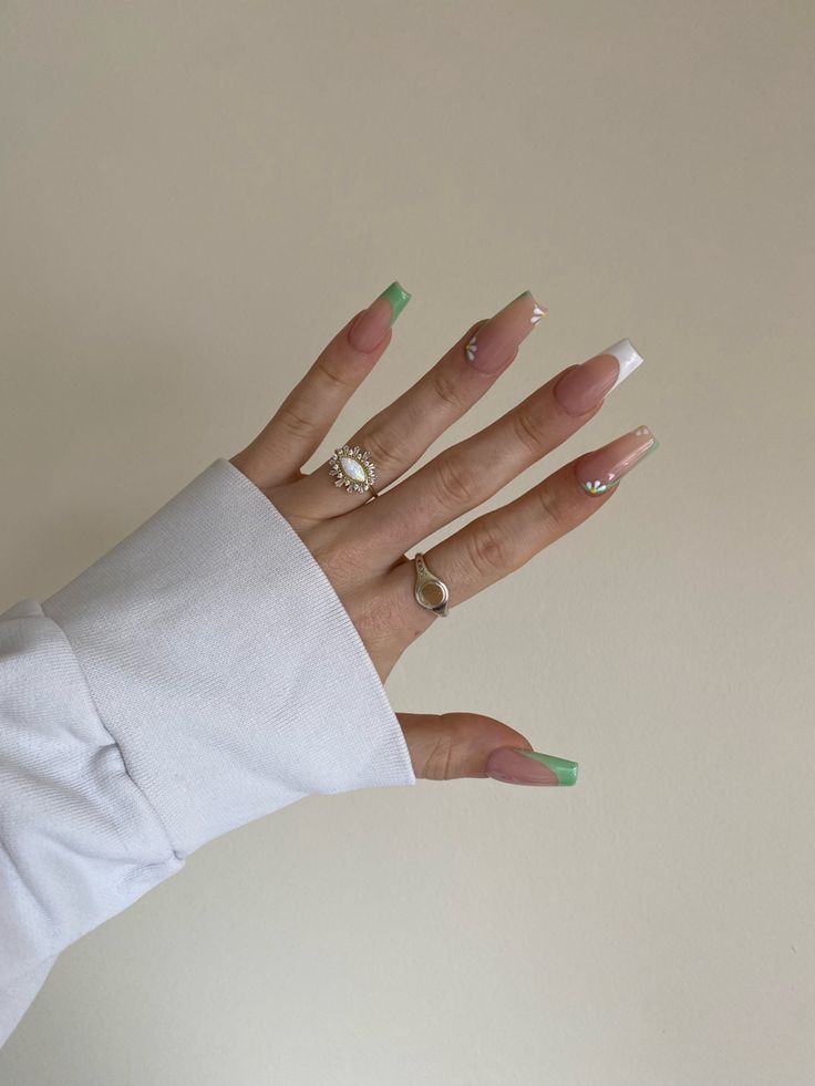 Chic Pink and Green French Tip Nail Design with Embellishments for Versatile Elegance.