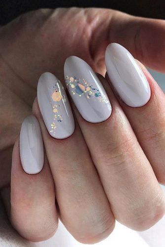 Sophisticated Lavender Nail Design with Playful Glitter Accents.