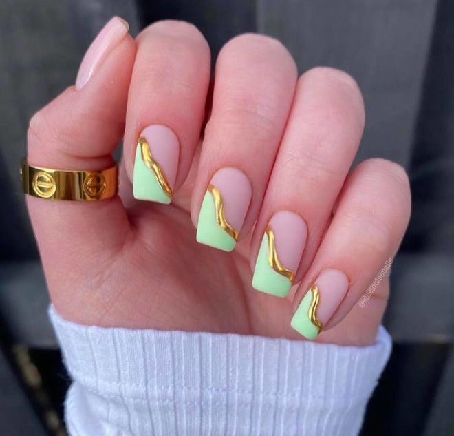 Sophisticated Pastel Mint Green Nails with Gold Wave Accent and Modern Texture Combination.