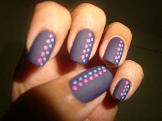 Playful Matte Purple Nail Art with Vibrant Polka Dots for a Chic Look.