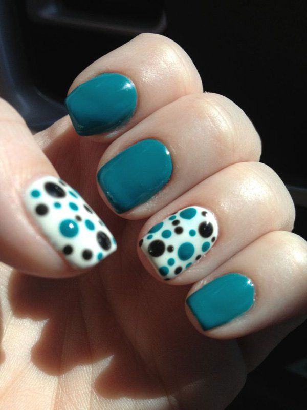 Vibrant Turquoise Nail Design with Playful Polka Dot Accent for a Cheerful Manicure.