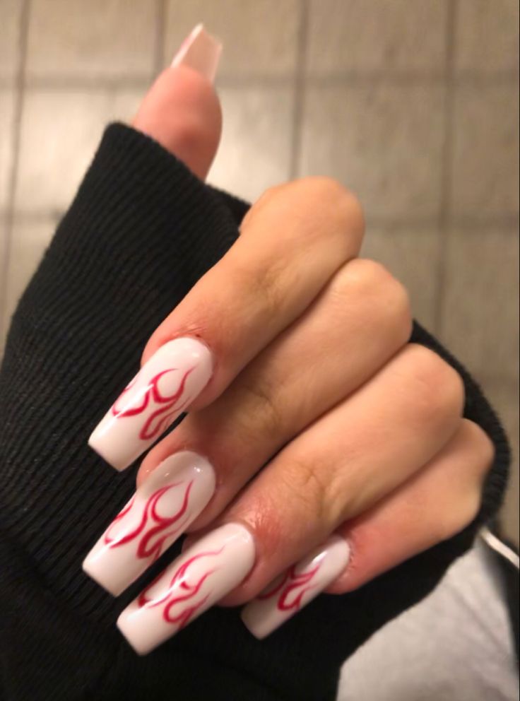 Bold Flame-Inspired Nail Design: Striking White Nails with Edgy Red Patterns