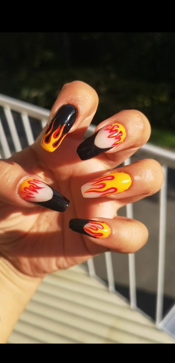 Vibrant Flame-Inspired Nail Design: Bold Colors and Intricate Patterns for Edgy Style.