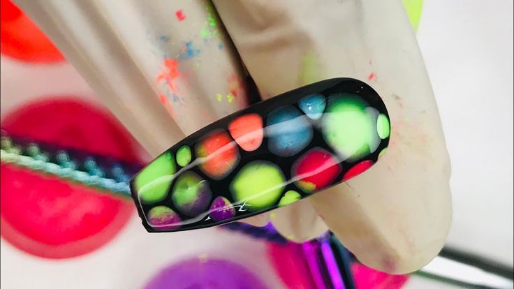 Neon Bubble Nail Art: Bold Expression Against a Black Canvas.