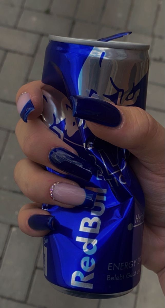 Chic Navy and Nude Nail Design with Glitter Accents Perfectly Paired with an Energy Drink.