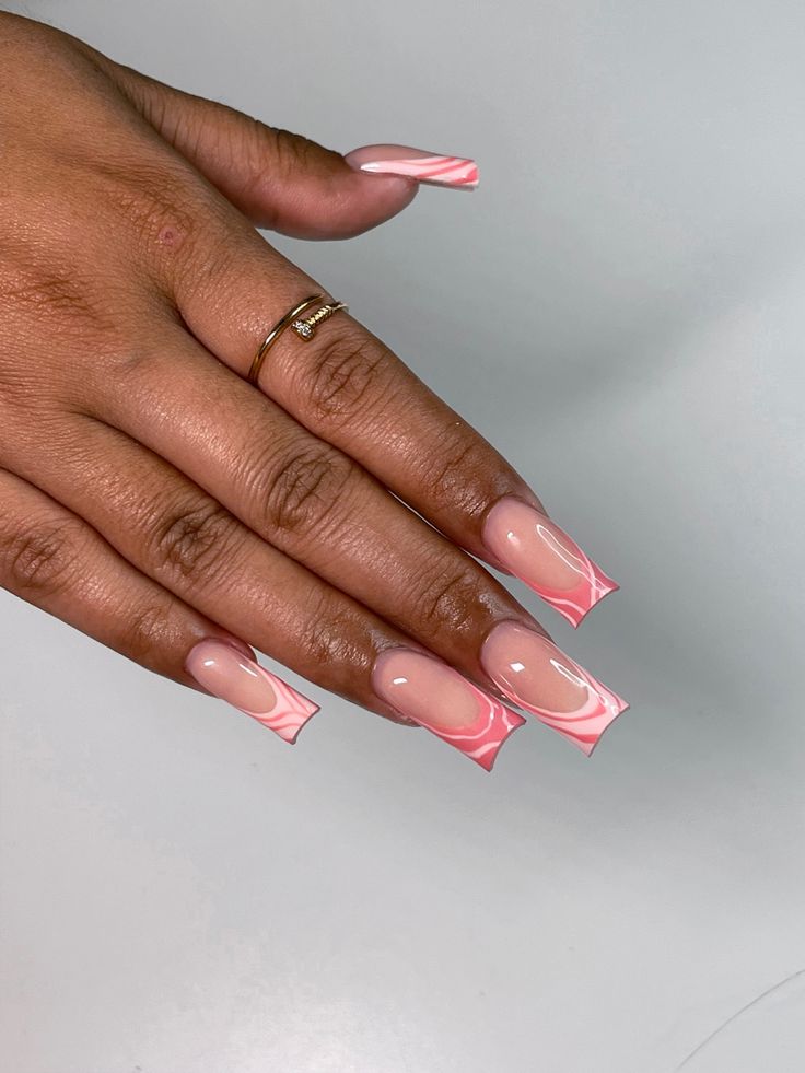 Elegant Long Acrylic Nail Design with Unique Marbled Patterns in Soft Nude and Pink Hues