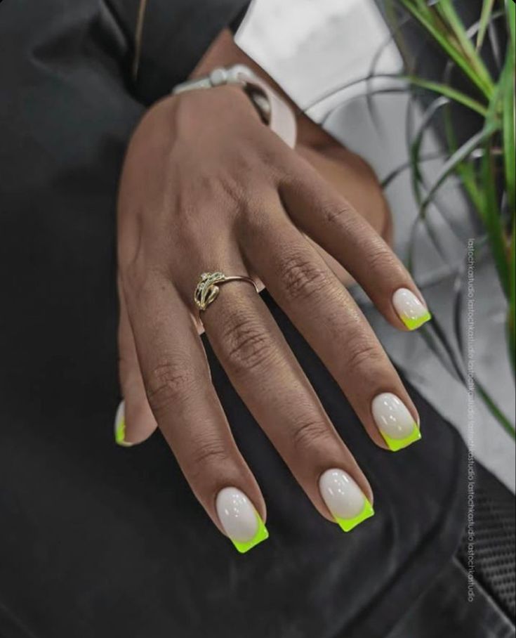 Modern Chic French Tips: Glossy White Nails with Vibrant Neon Green Tips for a Bold Statement.