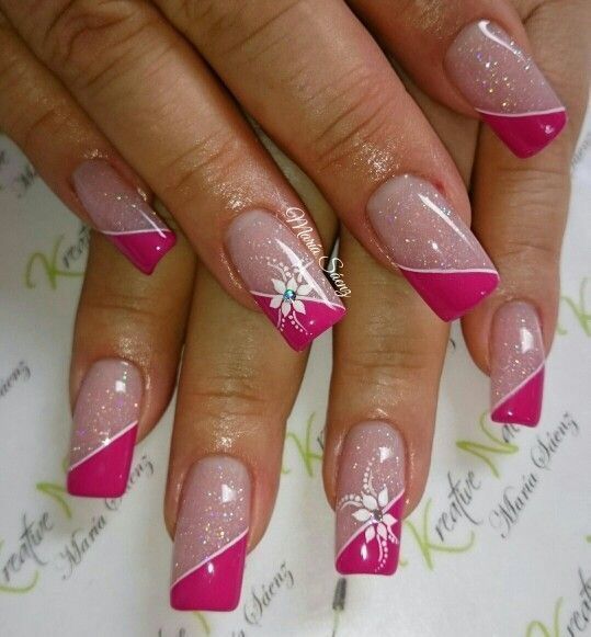 Elegant Gradient Nail Design with Pink Tips and Floral Accents.