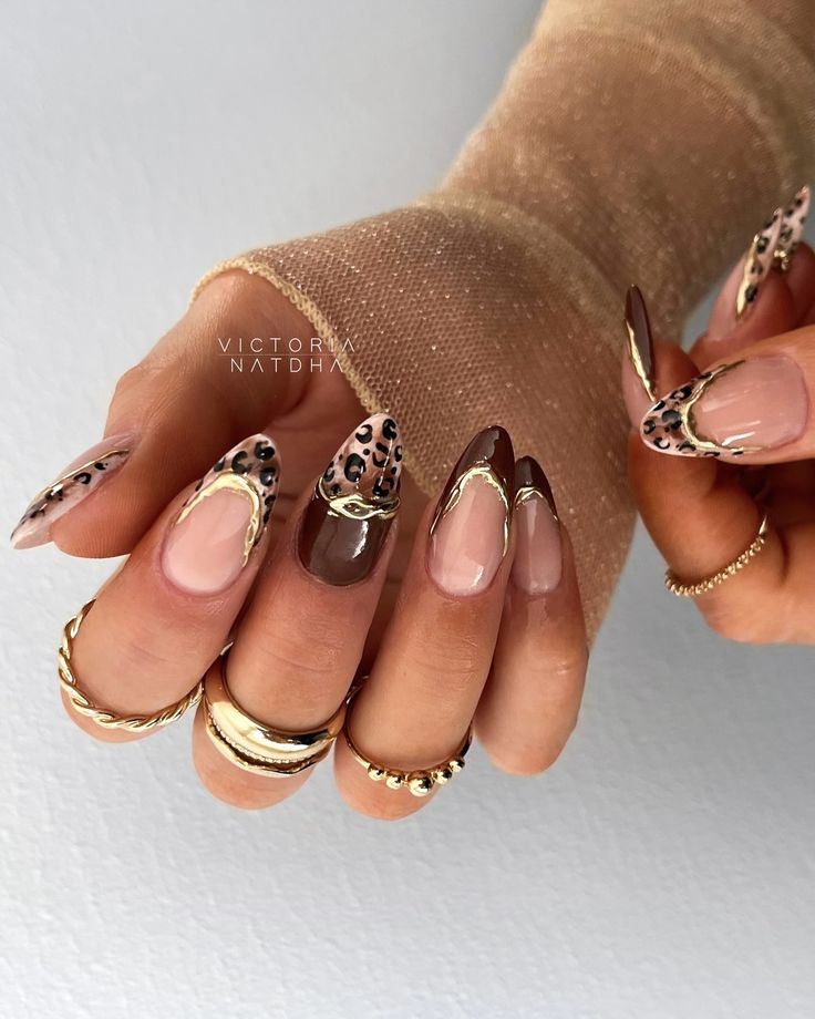 Sophisticated Nail Design: Neutral Tones, Animal Print, and Gold Accents