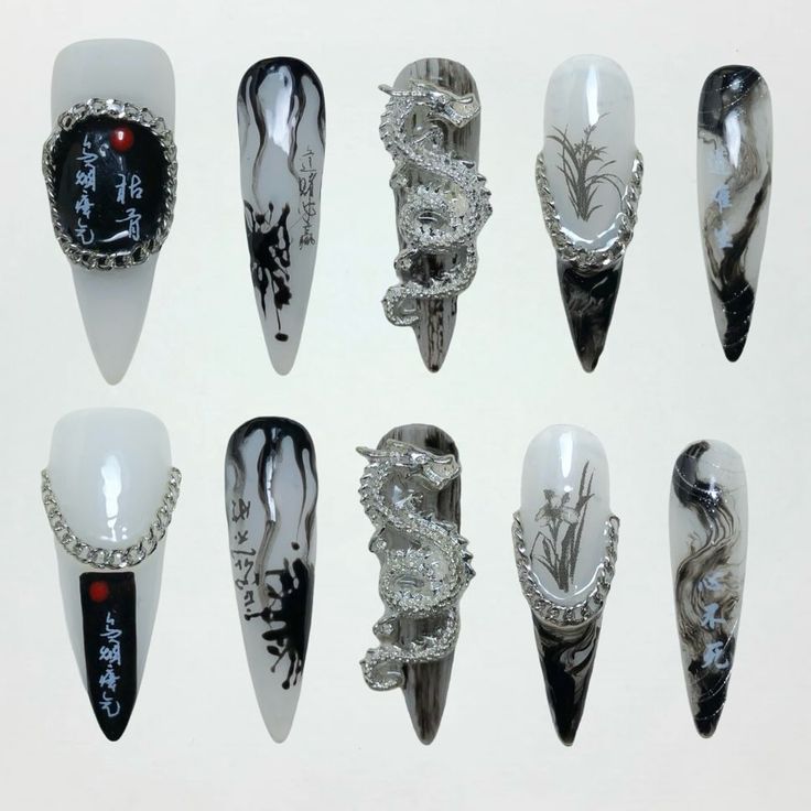 Sophisticated Black and White Nail Design with Abstract Patterns and Shimmering Dragon Accent