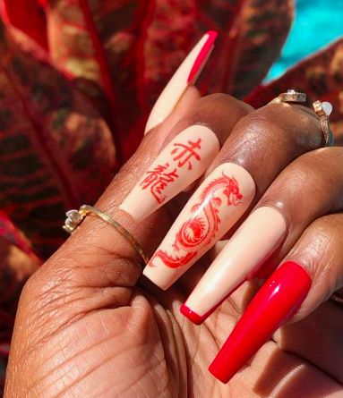 Elegant Red and Nude Nail Design with Intricate Dragon Artwork