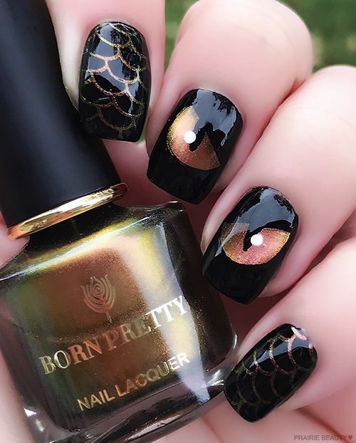 Gothic Nail Design: Striking Black Base with Gold and Copper Accents Featuring Spider Webs and Eye Motifs for an Elegant Halloween Look.