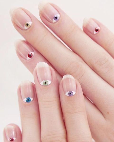 Playful Whimsical Eye Motif Nail Design on Clear Base