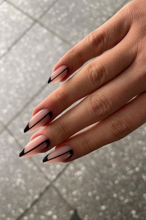 Chic Sophistication: Elegant Nude Nails with Bold Black Tips