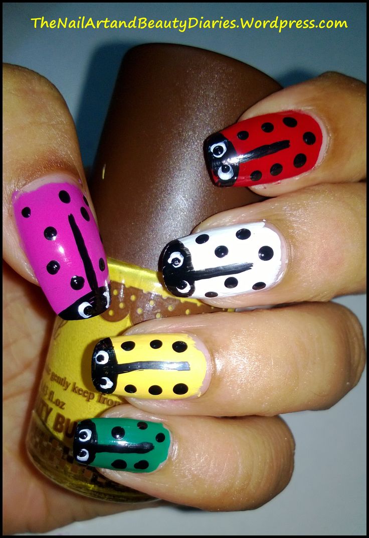 Whimsical Ladybug Nail Art Featuring Playful Colors and Classic Black Spots