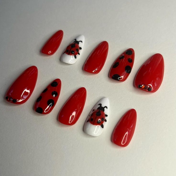 Vibrant Red Ladybug Nail Art: A Cheerful and Whimsical Design.