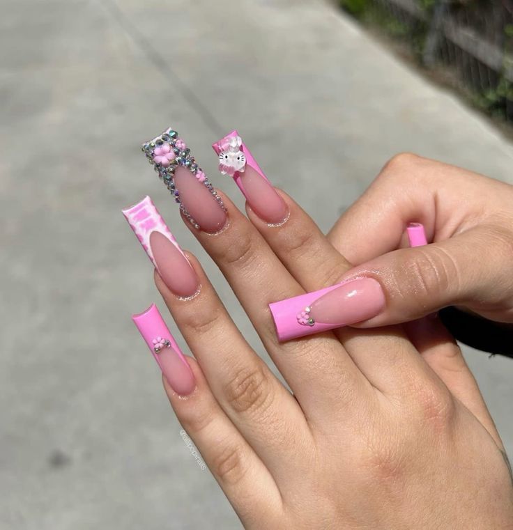 Vibrant Pink Nail Design: Elegant Glossy Tips with Whimsical Embellishments.