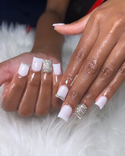 Elegant Glossy White Nail Design with Rhinestone Accents for Versatile Occasions