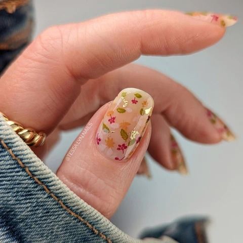 Vibrant Floral Nail Design with Clear Base and Gold Accents, Perfect for Spring/Summer.