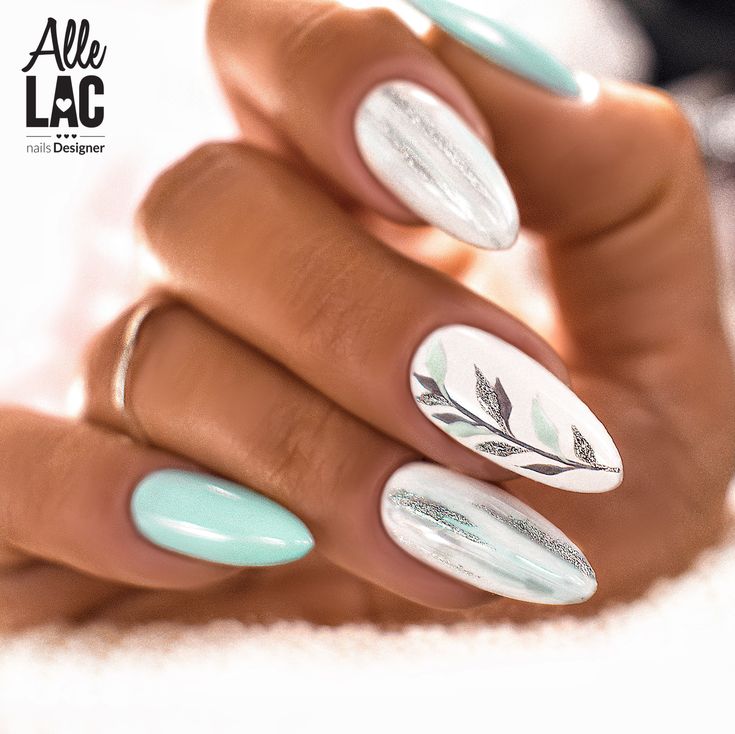 Chic Mint Green and White Nail Design with Sophisticated Silver Leaf Patterns