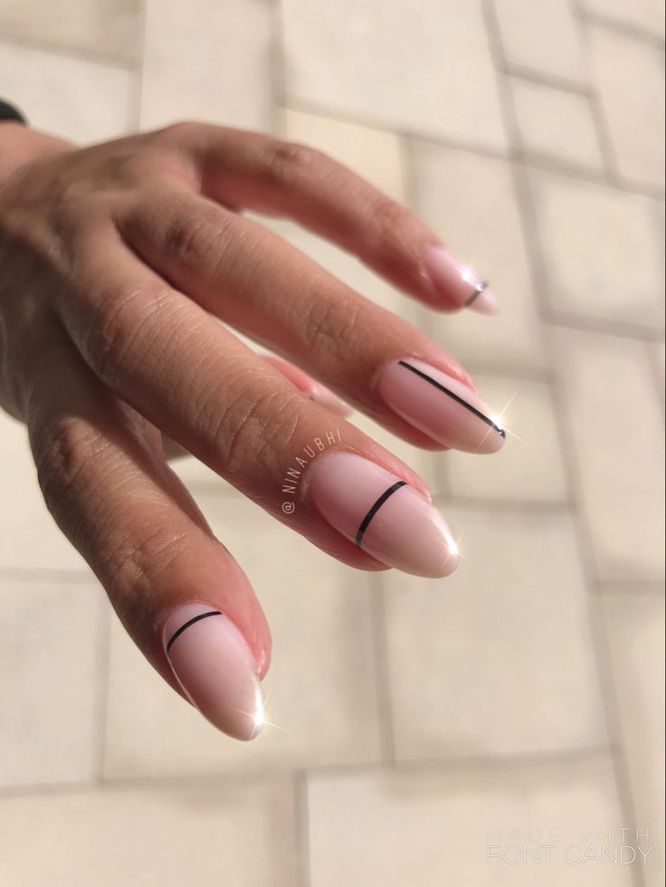 Chic Minimalist Nail Design: Soft Pink Base with Bold Black Accents