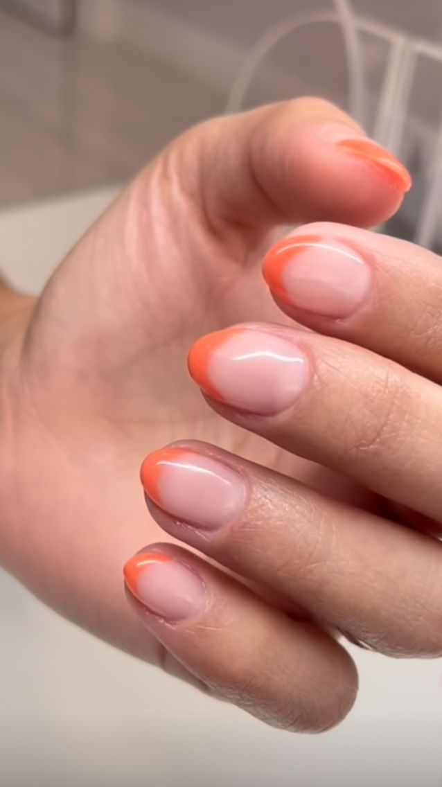 Elegant Gradient Nail Design with Vibrant Coral Tips