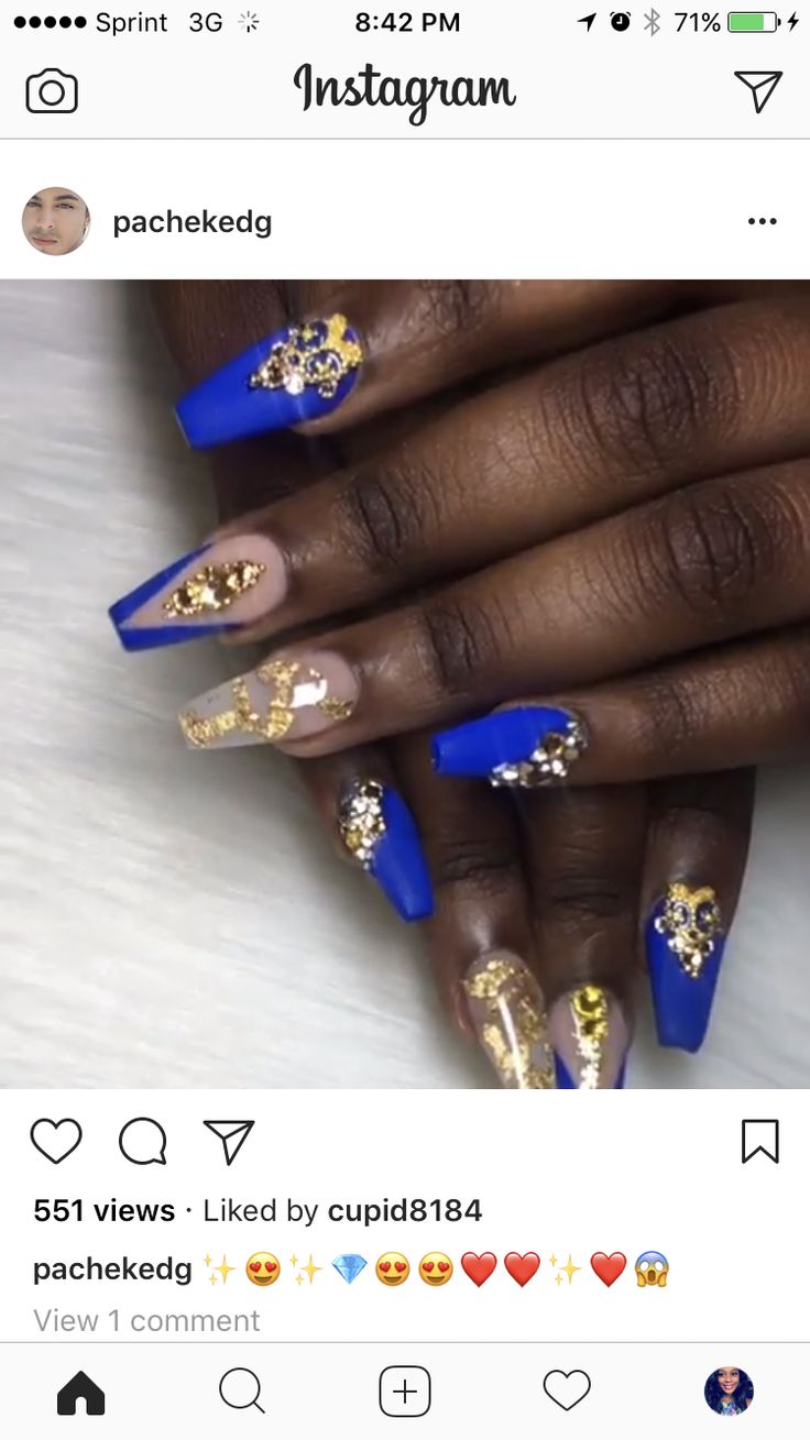 Luxurious Blue and Gold Nail Design: Bold Shades with Intricate Accents for a Statement Look.