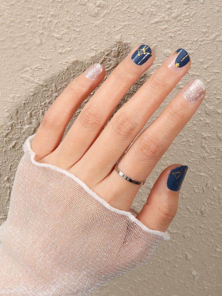 Chic Navy and Gold Geometric Nail Design with Sparkling Silver Accents.