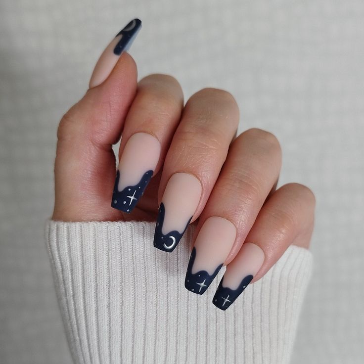 Elegant Matte and Glossy Navy Blue Nail Design with Whimsical Drip Effect and Artistic Accents.