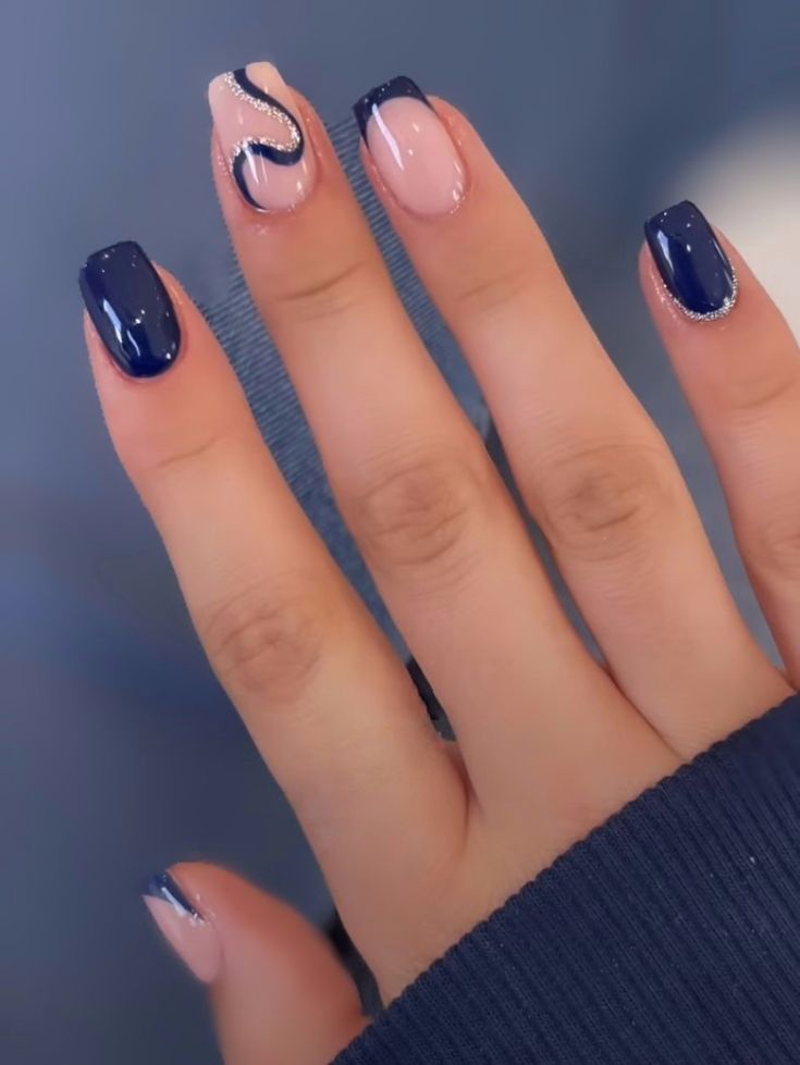 Chic Nail Design: Deep Navy and Pale Pink with Elegant Silver Accents.