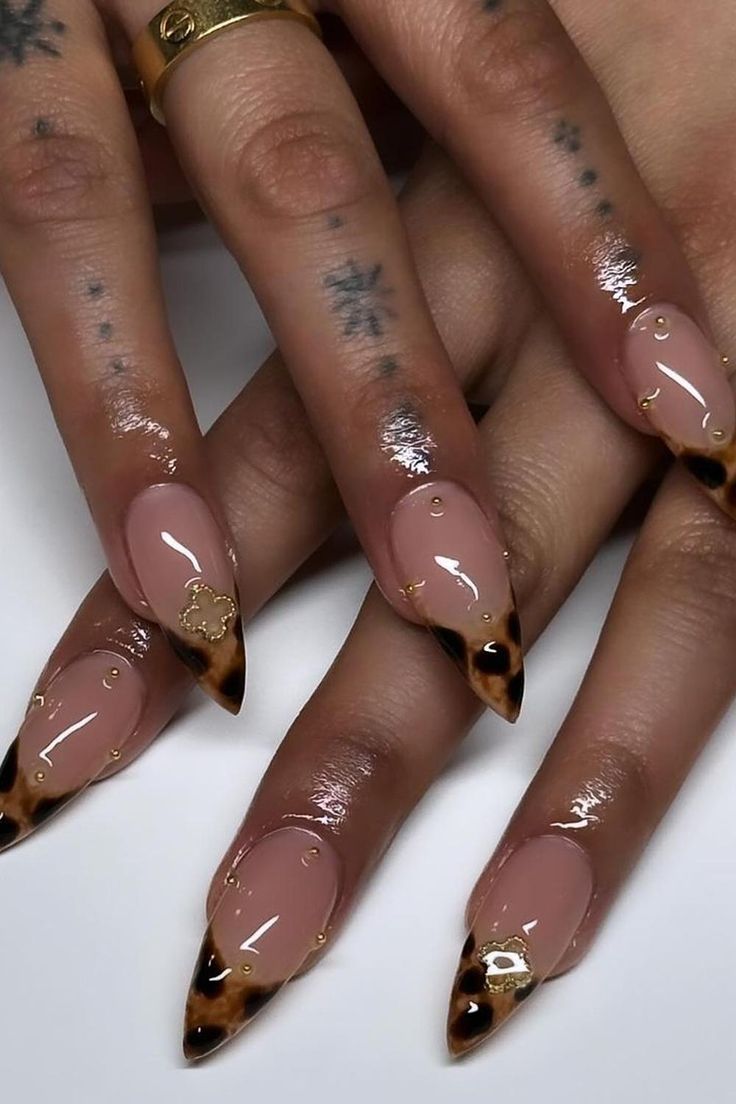 Chic Nude and Leopard Print Manicure with Gold Accents