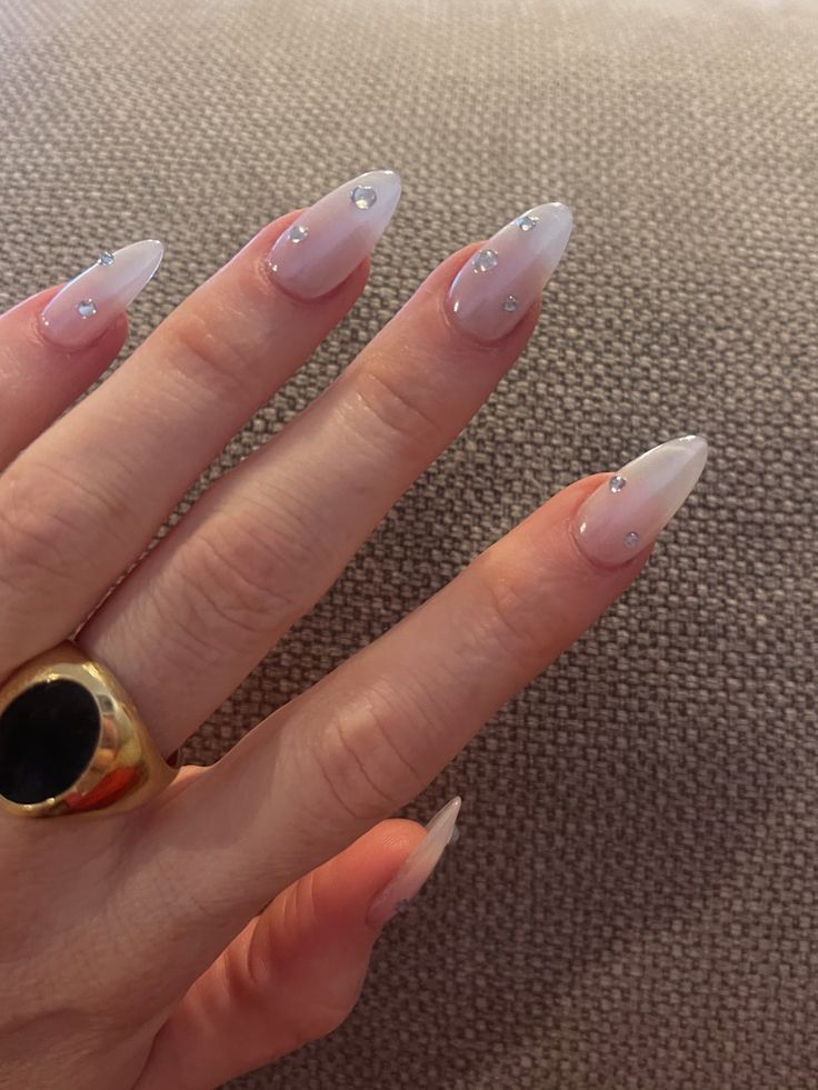 Chic Almond-Shaped Gradient Nails with Rhinestone Accents for a Sophisticated Look.