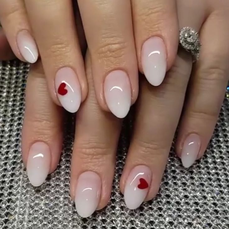 Elegant Almond-Shaped Nails with Gradient Finish and Playful Red Heart Accents