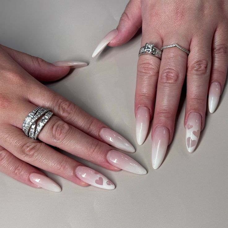 Chic Ombre Stiletto Nails with Heart Designs and Sparkling Accessories