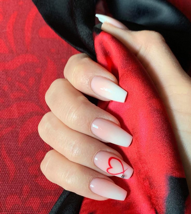 Chic Ombre Nail Design with Heart Accent for a Romantic Touch.