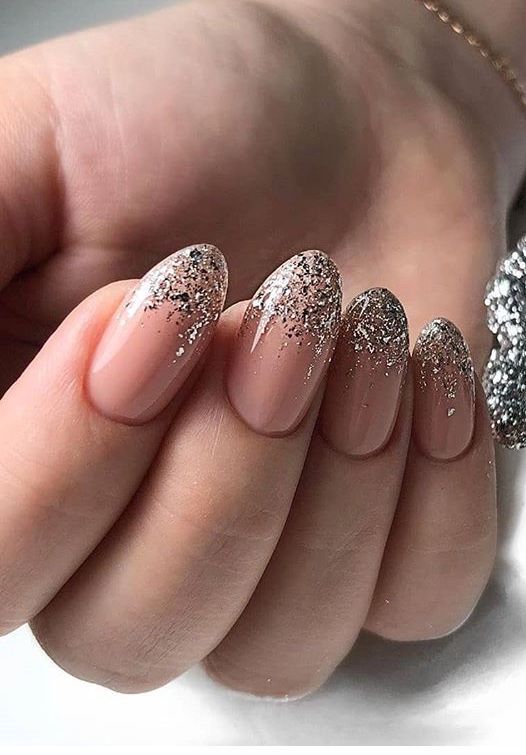 Sophisticated Nude Nail Design with Shimmering Silver Glitter Tips for Elegant Occasions.