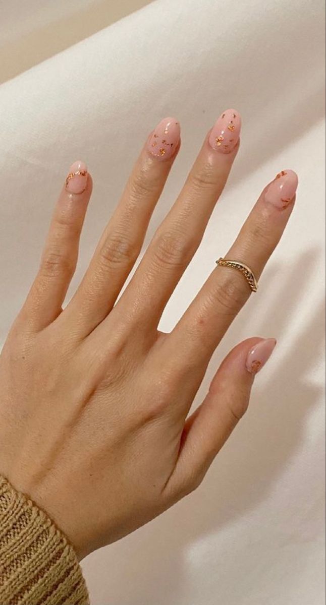 Elegant Soft Pink Nail Design with Gold Accents for Versatile Glamour.