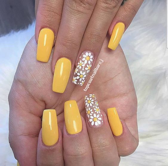 Cheerful Bright Yellow Nail Design with White Daisy Accents for a Lively Aesthetic.