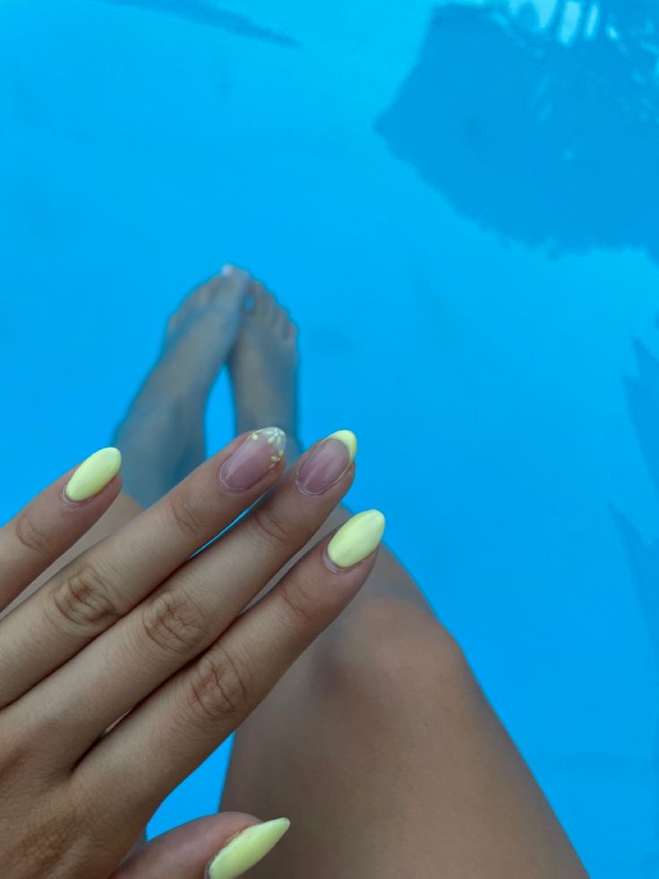 Elegant Summer Nail Design: Vibrant Yellow with Glossy, Matte Finishes and Subtle Nude Accents.