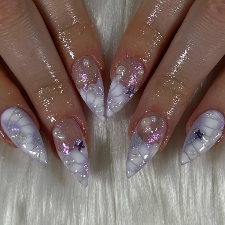 Glamorous Nail Design with Iridescent Gradient, 3D Textures, and Star Motifs.